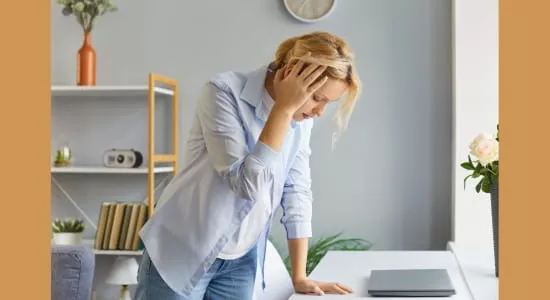 Woman experiencing dizziness and vertigo symptoms at home – treated with vestibular physiotherapy in Melbourne