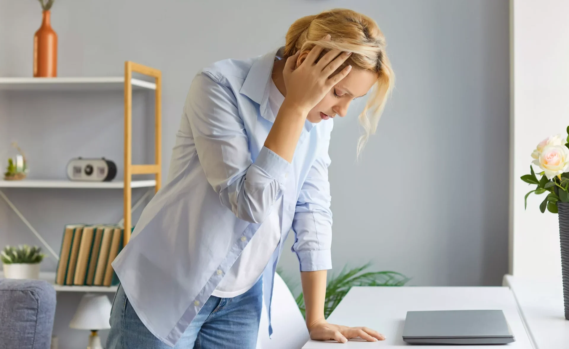 Woman experiencing dizziness and vertigo symptoms at home – treated with vestibular physiotherapy in Melbourne