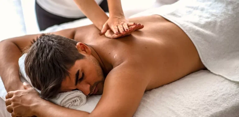 Remedial massage therapist providing hands-on back treatment in Melbourne