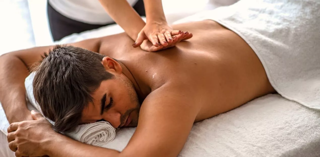 Remedial massage therapist providing hands-on back treatment in Melbourne